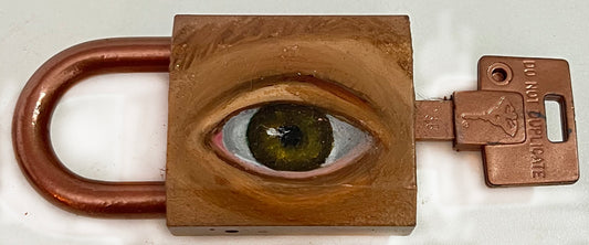 A padlock with a key, featuring an eye painted on it using oil paint and spray paint.