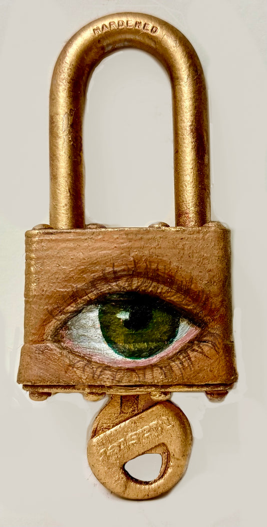 A padlock with a key, featuring an eye painted on it using oil paint and spray paint.